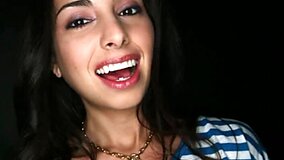 Pretty faced bitch is filmed handling a cock in a glory hole
