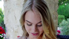 A blonde that has nice tits is alone outdoors, and she is nude
