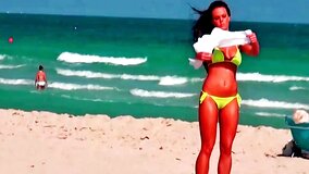 Sexy curves are seen on the beach in this scene